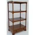 A Victorian rosewood four tier whatnot, with brass galleried top, with drawer below, barley twist su... 