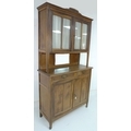 A French 19th century oak dresser, with glazed doors above and two drawers above cupboard below, wit... 