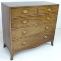 A George IV mahogany chest of two over three long drawers, raised on outswept bracket feet, 107 by 4... 