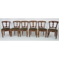 A set of six Victorian dining chairs with sage green velvet upholstered seats, central splat to back... 