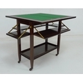 A late 19th or early 20th century rosewood card table with unusual four fold down shelves, marked Tu... 