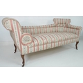 An Edwardian double ended chaise longue, with scroll ends and cabriole front legs with castors, upho... 