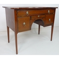 A Regency mahogany and inlaid dressing table, the shaped surface above an arrangement of four drawer... 
