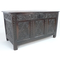 A 17th century oak dower chest, the triple panelled front carved with stylised fleur-de-lys flanked ... 