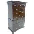 A George III mahogany tallboy, chest on chest, the pediment with dentil moulding, two short, one med... 