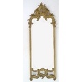 A 19th century giltwood pier mirror, with pierced lattice, C scroll and foliate carved pediment, mou... 