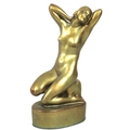 An Art Deco Zsolnay Pecs figurine, modelled as a female nude in kneeling pose with her hand clasped ... 