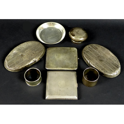 28 - A group of silver, comprising an engine turned cigarette case, Birmingham 1924, Henry Matthews, a se... 