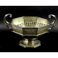 An Edward VIII silver octagonal twin handled trophy, flying scroll handles, stepped octagonal base, ... 