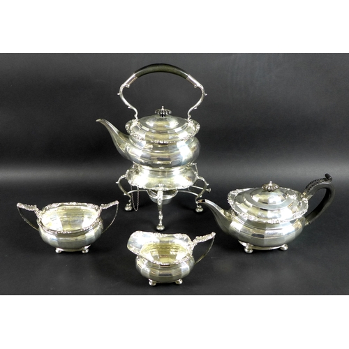 78 - A George V four piece silver tea set comprising tea pot, milk jug, sucrier and spirit kettle on stan... 