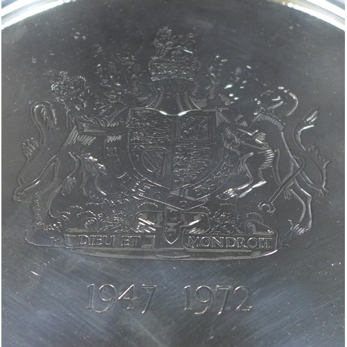 4 - An Elizabeth II silver salver commemorating her Silver Wedding, engraved with the Royal Coat of Arms... 