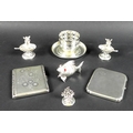 A collection of silver including a pair of miniature Continental silver salt cellars formed as music... 