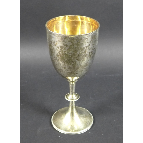 60 - A Victorian silver goblet with plain bowl, knopped stem and beaded foot rim, London 1896, indistinct... 