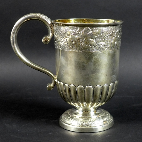 54 - A large George VI silver christening cup, the body and foot chased and embossed with bands of traili... 