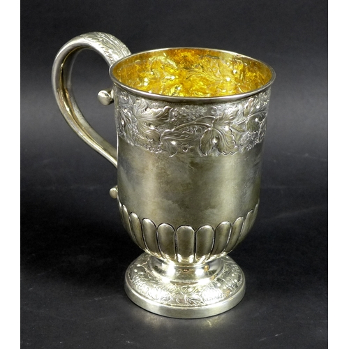 54 - A large George VI silver christening cup, the body and foot chased and embossed with bands of traili... 