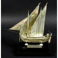 A Maltese silver model of a boat or Dghajsa, hallmarked to skeg beneath the keel, on ebonised plinth... 