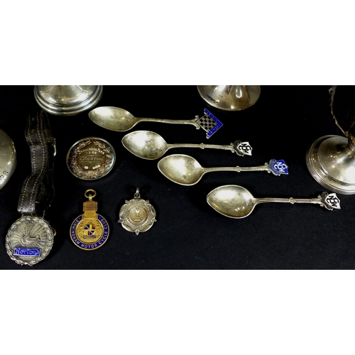 32 - A group of silver sporting trophies, spoons and medals awarded to Tom Morton, comprising 'NWGC Holly... 