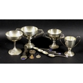 A group of silver sporting trophies, spoons and medals awarded to Tom Morton, comprising 'NWGC Holly... 