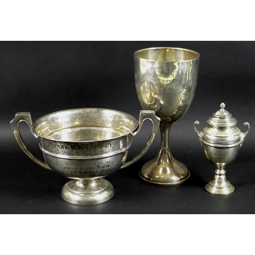 33 - A group of three Edwardian silver sporting trophies awarded to Tom Morton, comprising a twin handled... 