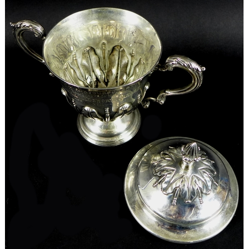 15 - An Edwardian silver golfing trophy, of twin handled urn form with cover, entitled 'The Houldsworth F... 