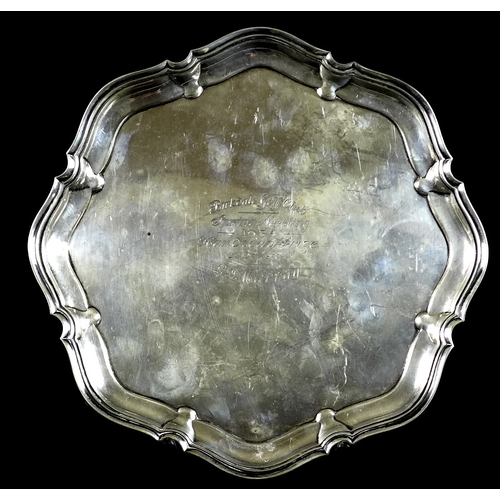 46 - A George V silver salver presented by Birkdale Golf Club, with pie crust edge, raised on four legs, ... 
