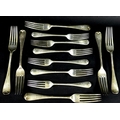 A set of six Edward VII silver table forks and six dessert forks, Old English pattern, terminals eng... 