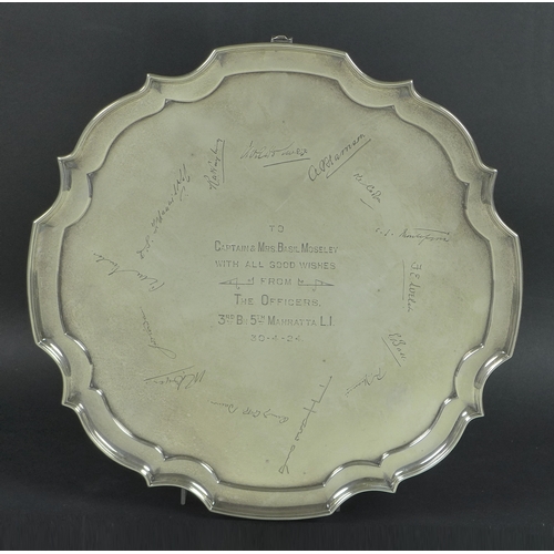 47 - A silver salver with pie crust rim, the body with central inscription engraved 'To Captain and Mrs B... 