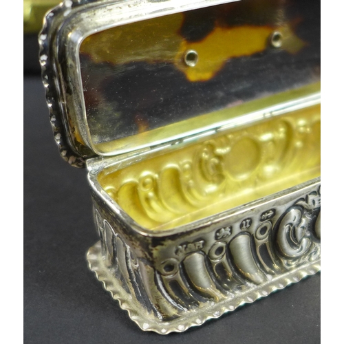 57 - A Victorian silver snuff box with tortoiseshell lid, the silver sides chased and embossed with scrol... 