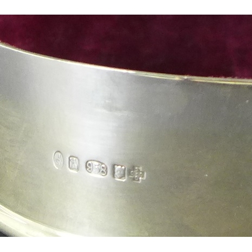 7 - An Elizabeth II silver box by Asprey & Garrard, of circular form with stepped rim to lid, the lid en... 