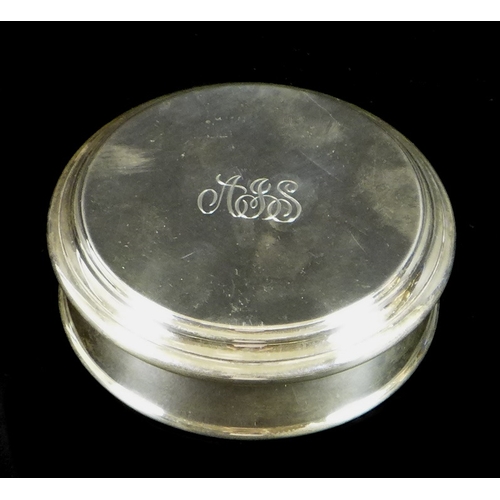 7 - An Elizabeth II silver box by Asprey & Garrard, of circular form with stepped rim to lid, the lid en... 
