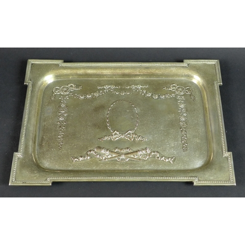 53 - A George V rectangular silver tray, the body decorated with floral swags, bows, ribbons and torches,... 
