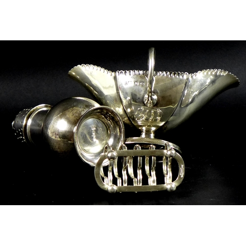 65 - A group of three Victorian and Edwardian silver items, comprising a sugar castor, Pairpoint Brothers... 