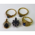 A group of 9ct gold jewellery, comprising a sapphire pendant, a sapphire and diamond dress ring, siz... 