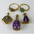 A group of 9ct gold jewellery, comprising an amethyst and diamond pendant, the large pear cut amethy... 