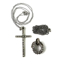 A diamond and white metal cross pendant set with 19 diamonds, on a 9ct white gold chain, 3.5g total,... 