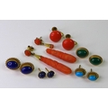 Six pairs of 1920s earrings, including a pair of rose coral carved drops , a/f, coral studs with cli... 