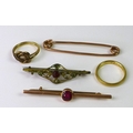 A group of jewellery, comprising an 18ct gold band, size M, 3g, a 9ct gold and ruby tiepin, a 9ct go... 