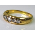 An 18ct gold ring set with five diamonds, approx 0.3cts total diamond weight, 3.8g.
