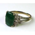 A vintage 1970's 18ct white gold, diamond and jade dress ring, with central jade cabouchon of approx... 