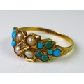 A Victorian gold ring set with turquoises, seed pearls and central diamond, marks to band rubbed but... 