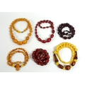 A collection of vintage amber coloured bead necklaces, bakelite and plastic, various hues including ... 