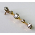 A five stone diamond set yellow metal bar brooch, the central diamond approx 0.5ct, the two end diam... 