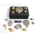 A collection of jewellery and badges including a single 15ct gold cufflink, 3.8g, a 9ct gold cross a... 
