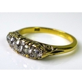 A Victorian 18ct gold and five stone diamond ring, the five graduated old cut diamonds with two furt... 