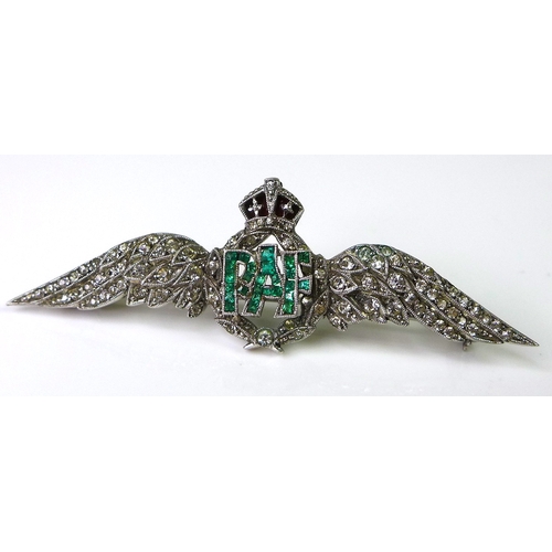 231 - An 18ct white gold RAF dress brooch set with diamonds and emeralds, two diamond encrusted wings flan... 