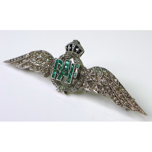 231 - An 18ct white gold RAF dress brooch set with diamonds and emeralds, two diamond encrusted wings flan... 