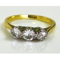 An 18ct gold three stone diamond ring, approx 0.5ct total diamond weight, size K, 2.4g.