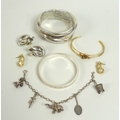 A collection of vintage and modern silver jewellery, including a silver bangle, the exterior of the ... 