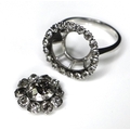 A 19th century and later diamond flowerhead ring, the central old cut diamond approx 1ct, 6mm across... 