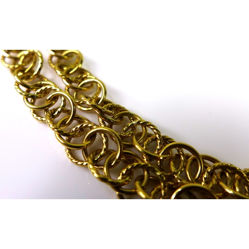 260 - A Kutchinsky 18ct gold chain link necklace, formed of interconnected plain and fine rope twist rings... 